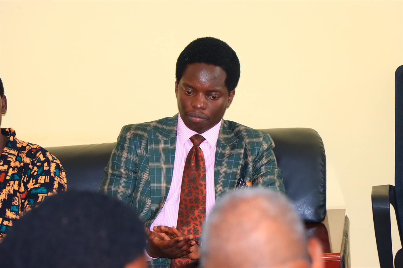A guest listening during a seated discussion